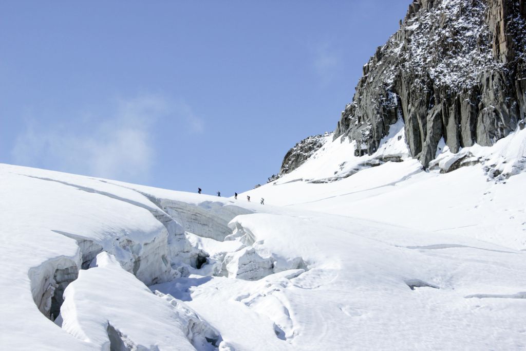 Climbers traverse snow-covered terrain at Mont Blanc, Chamonix.