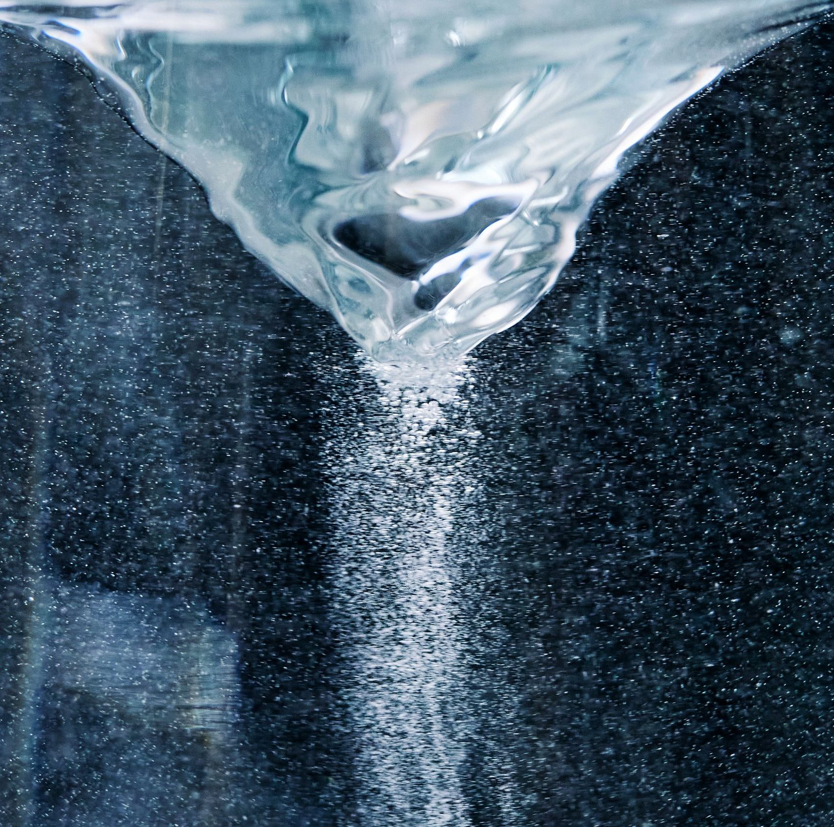 Close-up of a swirling water vortex, showcasing fluid dynamics and visual effects.