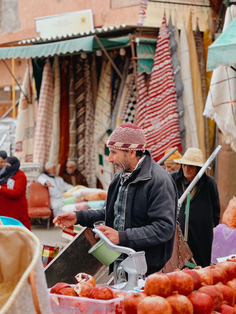 Colorful market activity in Marrakech's historic Medina, highlighting everyday life in Morocco.